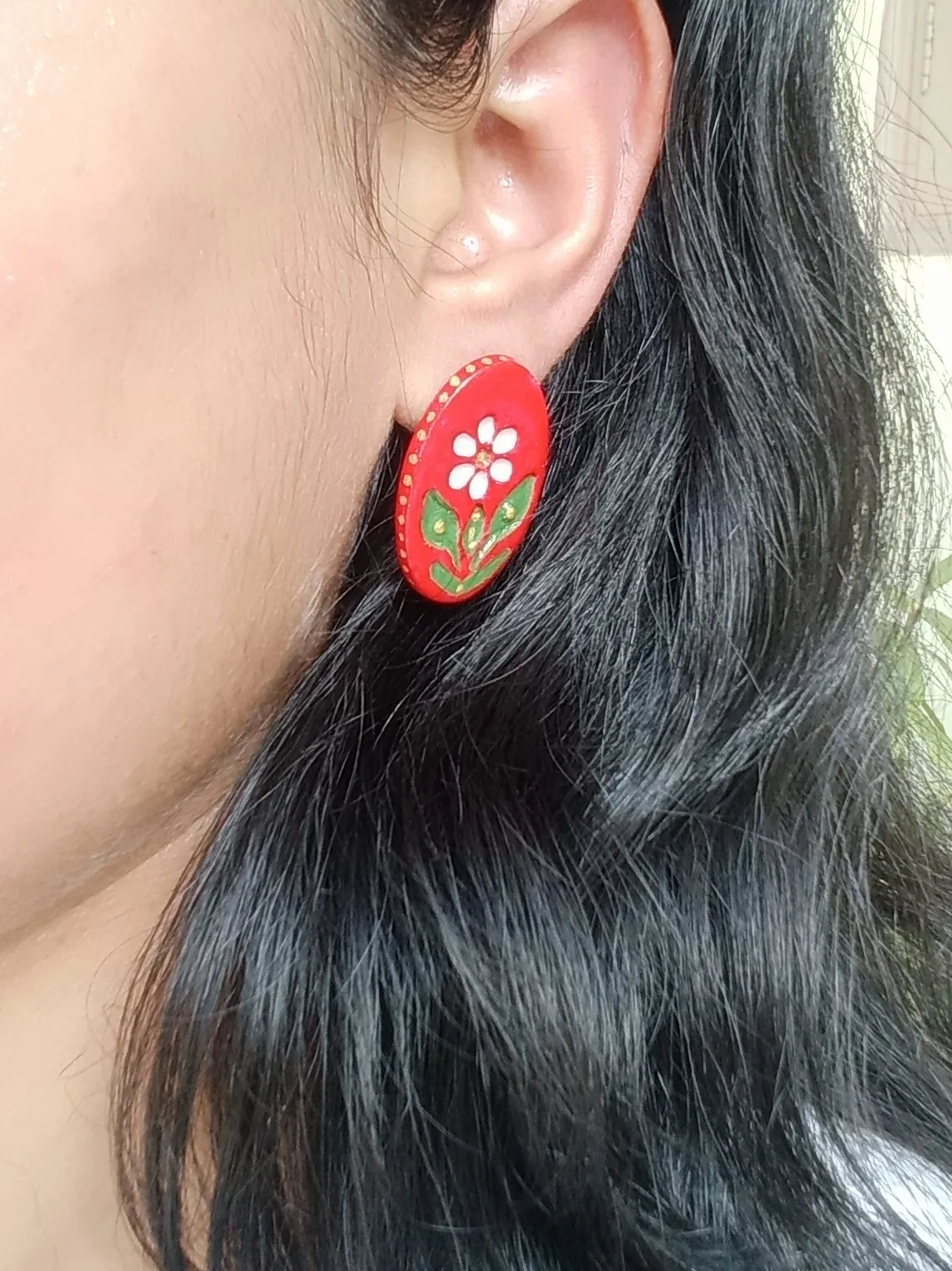 Oval Clay Studs With An Engraved Ethnic Floral Design In A Beautiful Red Colour