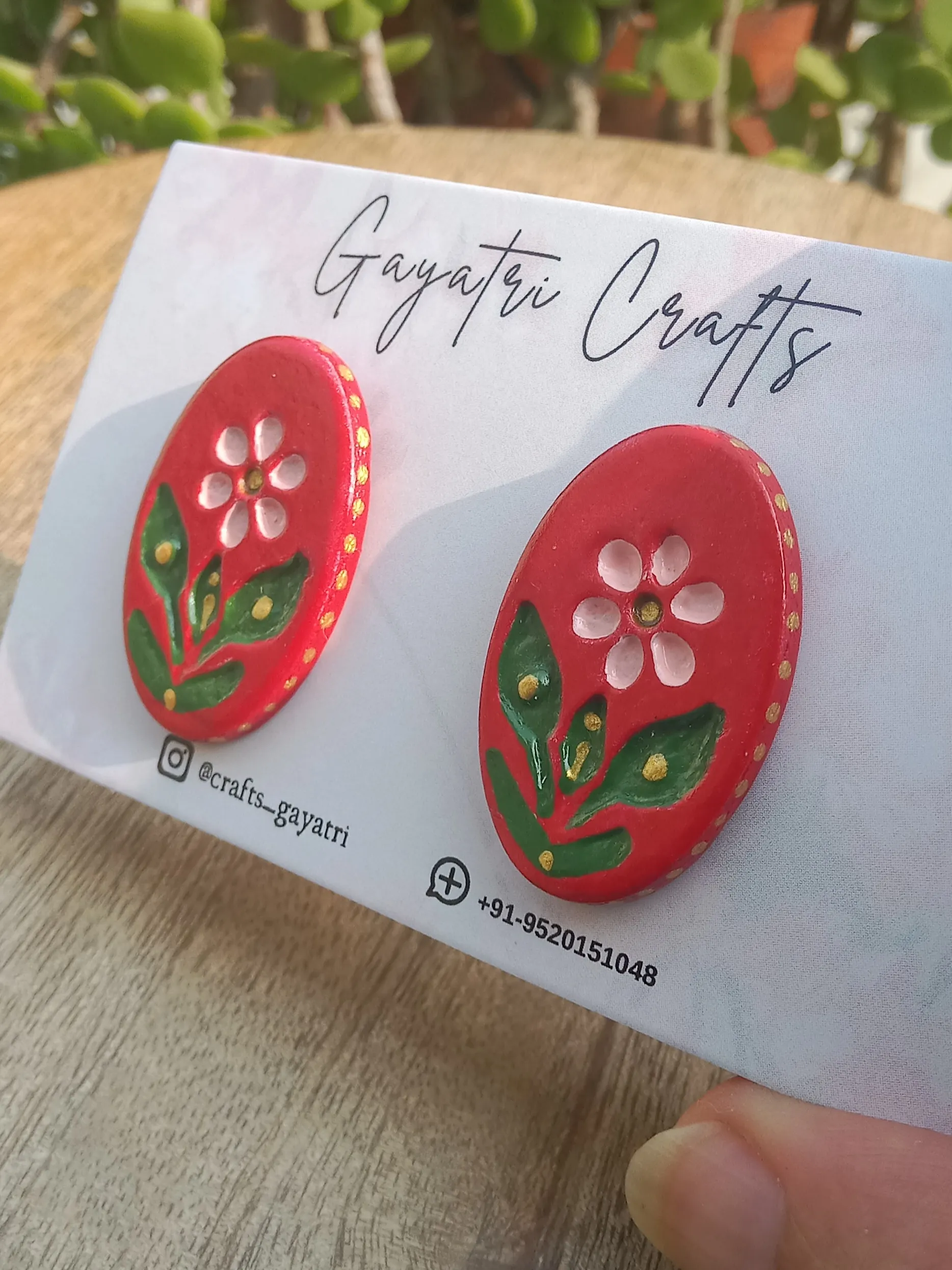 Oval Clay Studs With An Engraved Ethnic Floral Design In A Beautiful Red Colour