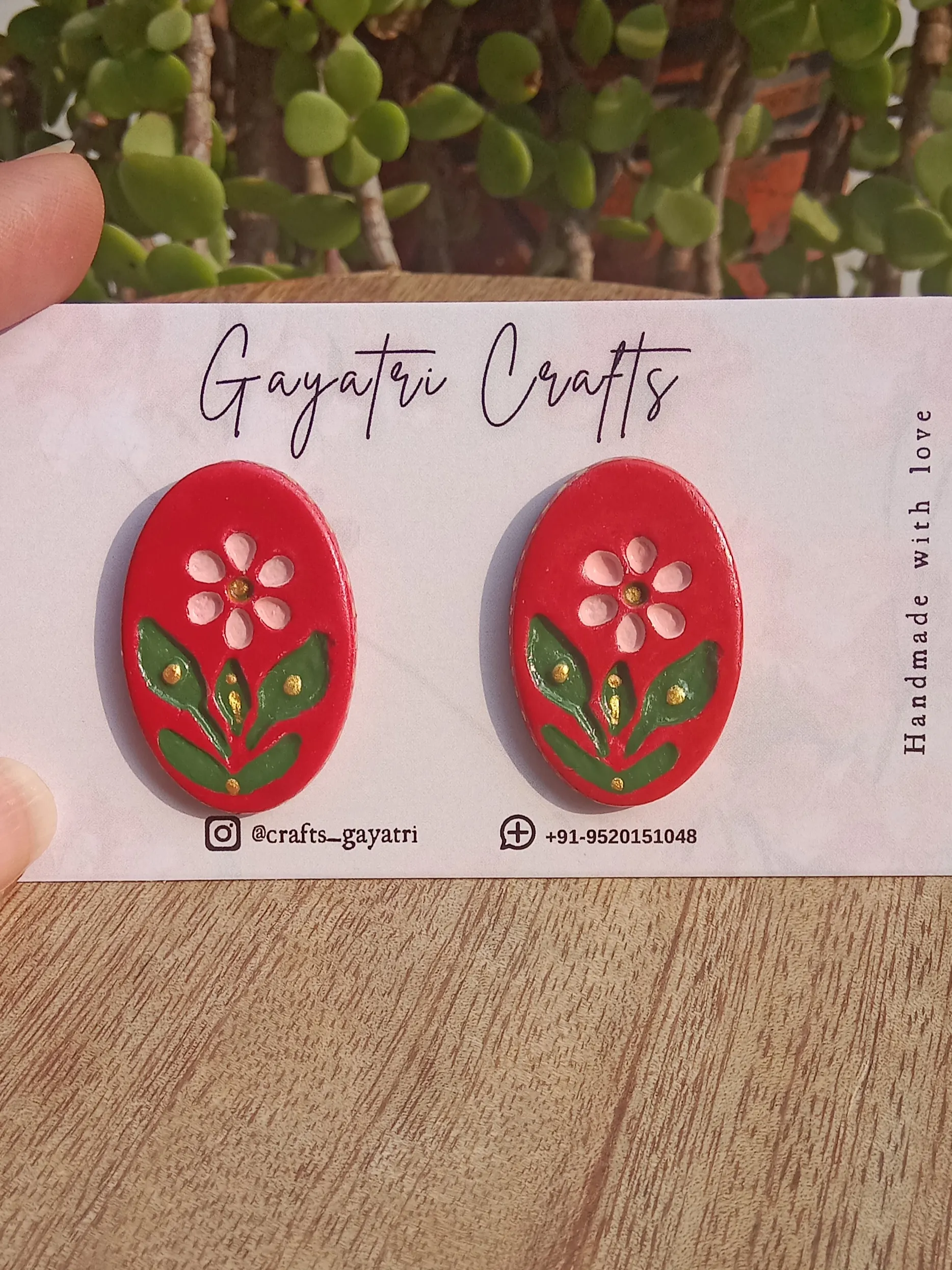 Oval Clay Studs With An Engraved Ethnic Floral Design In A Beautiful Red Colour